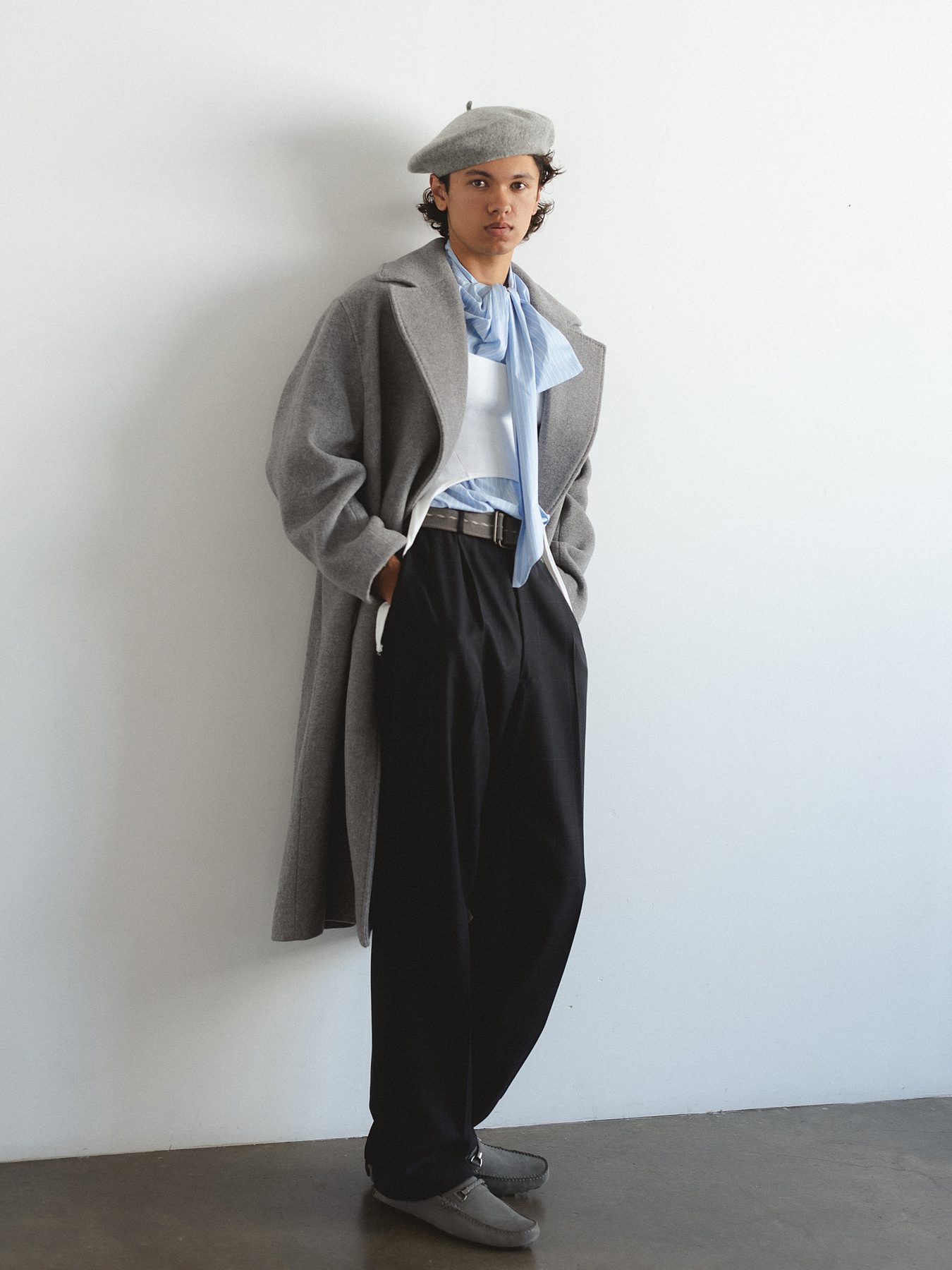 Quentin Lee in grey wool coat and beret