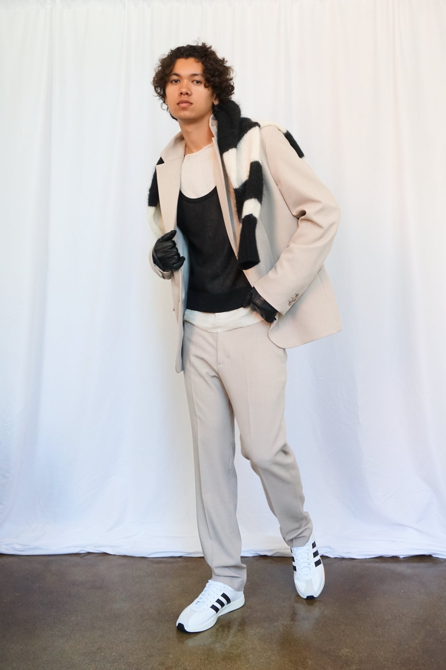 Quentin Lee, full-length editorial portrait in tailored beige suit